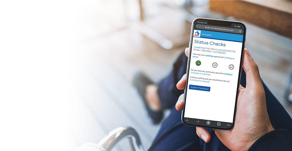 Person looking at phone showing Atlas customer portal